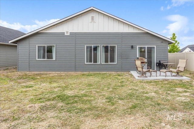 5144 W W Grand Rapids Dr, Meridian, ID 83646 - rear view of house with a patio area and board and batten siding