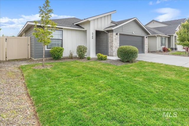 5144 W W Grand Rapids Dr, Meridian, ID 83646 - view of front of property featuring board and batten siding, an attached garage, and concrete driveway
