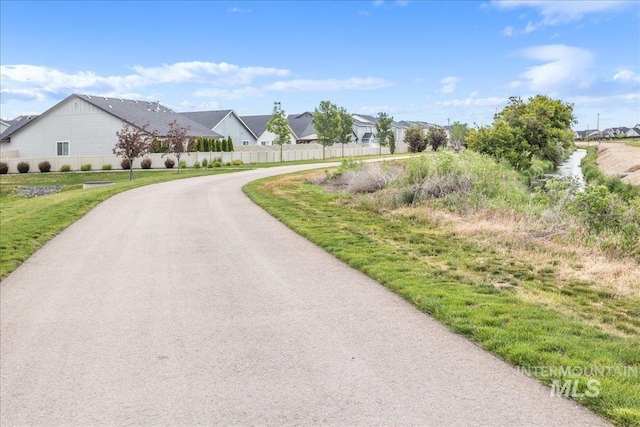 5144 W W Grand Rapids Dr, Meridian, ID 83646 - view of asphalt street with a residential view