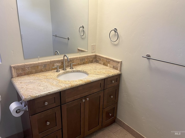 bathroom with tile patterned floors and vanity