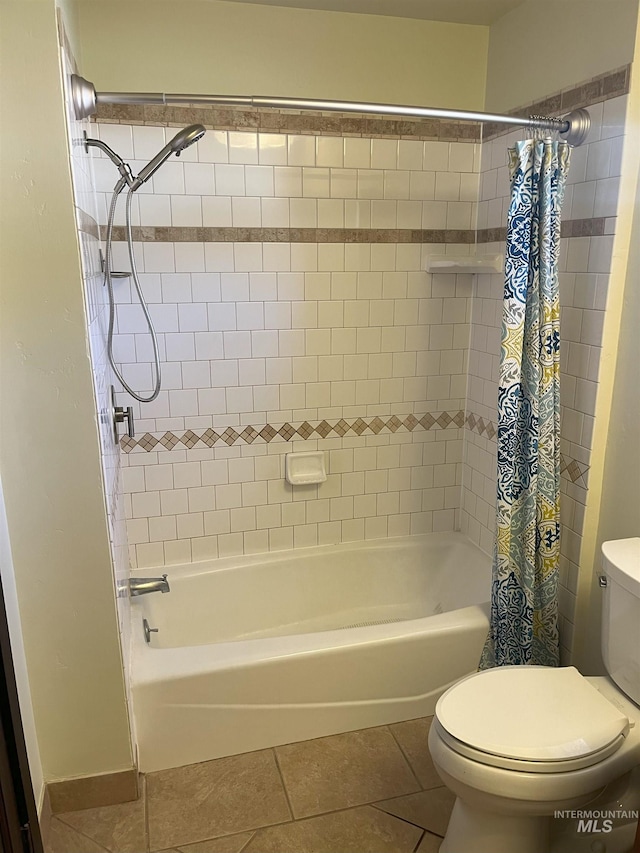 bathroom featuring shower / tub combo, toilet, and tile patterned flooring