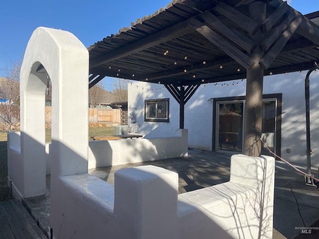 view of patio featuring a pergola