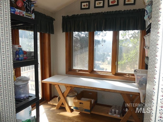2597 Price Valley Rd, New Meadows, ID 83654 - dining room with wallpapered walls, wood finished floors, and lofted ceiling