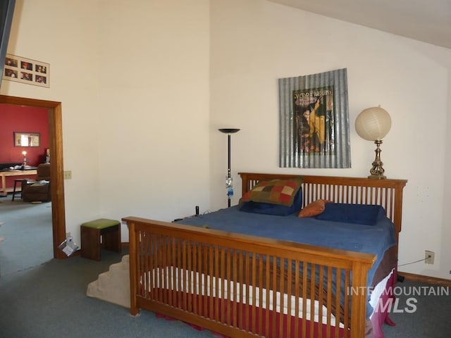 2597 Price Valley Rd, New Meadows, ID 83654 - bedroom featuring carpet floors, high vaulted ceiling, a desk, and baseboards