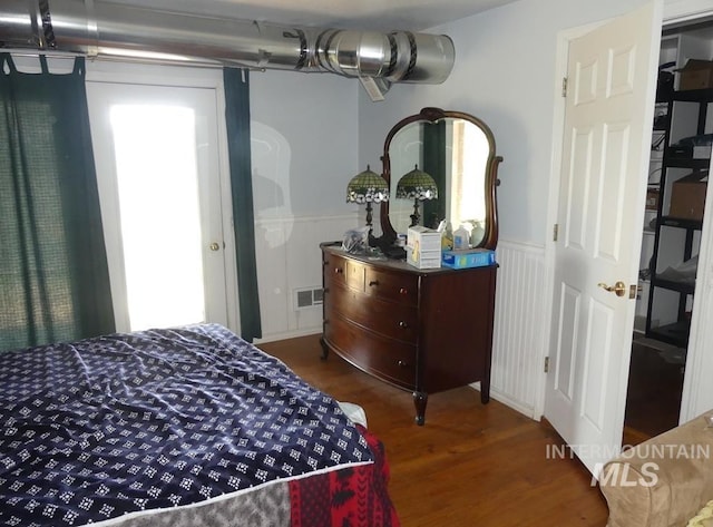 2597 Price Valley Rd, New Meadows, ID 83654 - bedroom featuring wood finished floors and wainscoting