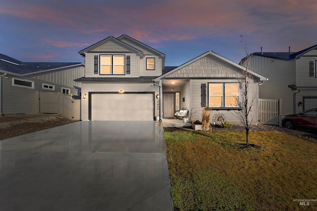 view of front of home featuring a lawn and a garage