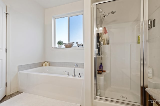 bathroom with independent shower and bath