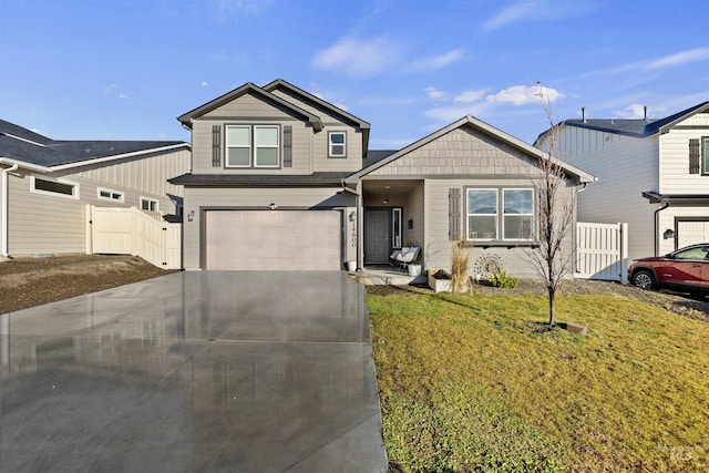 view of front facade featuring a garage and a front lawn