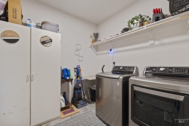 laundry area with washing machine and clothes dryer