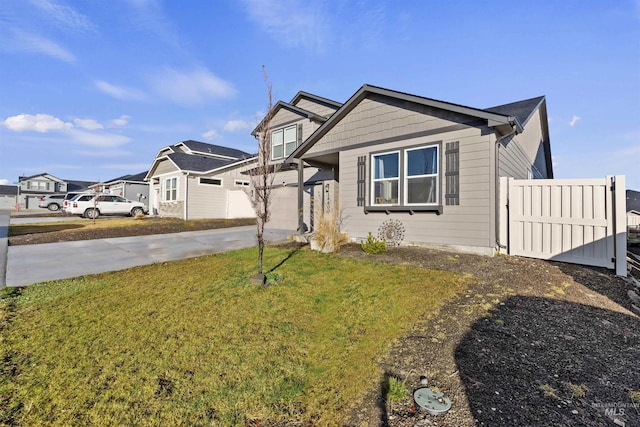 view of front of house with a garage and a front yard