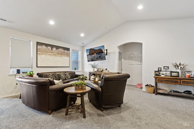 living room with lofted ceiling and carpet floors