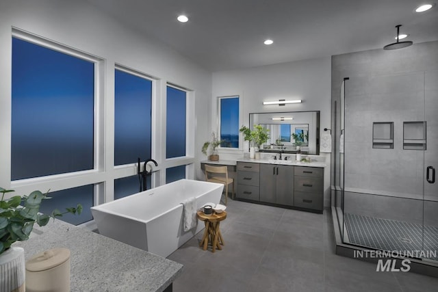 full bath featuring vanity, a shower stall, recessed lighting, and a freestanding bath