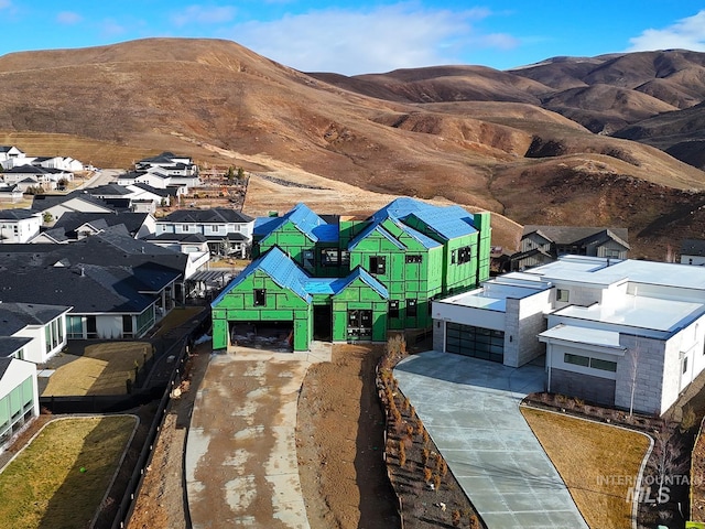 aerial view with a mountain view and a residential view