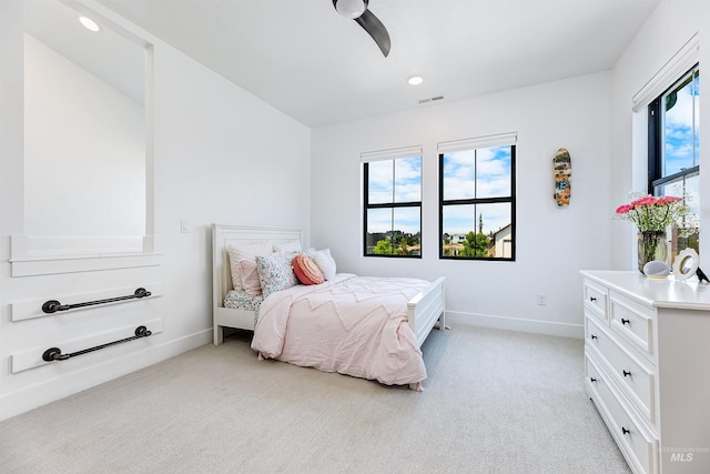 bedroom featuring light colored carpet, baseboards, ceiling fan, and recessed lighting