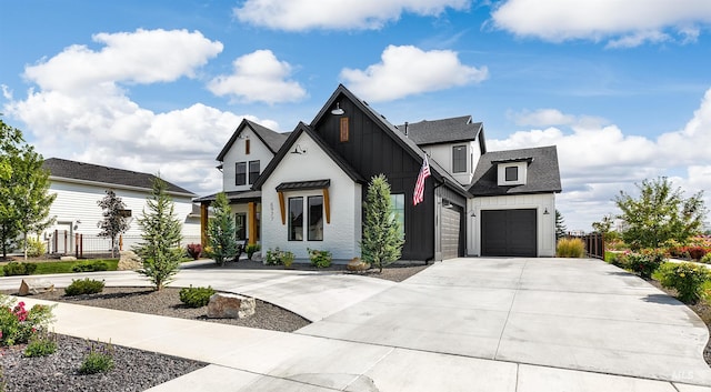 modern farmhouse style home with board and batten siding, driveway, a shingled roof, a garage, and fence