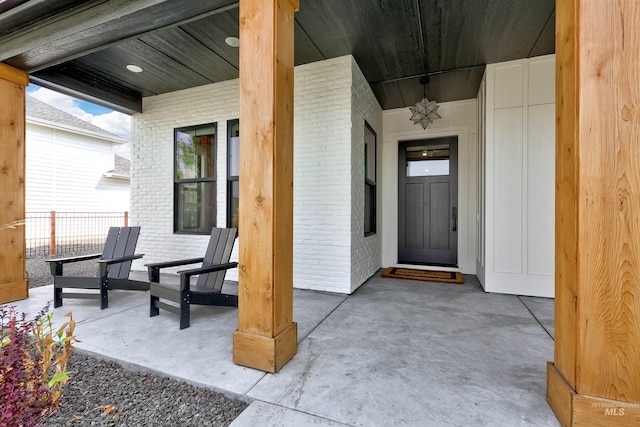 property entrance with brick siding
