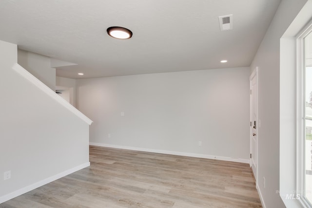 unfurnished room with recessed lighting, visible vents, baseboards, and light wood finished floors