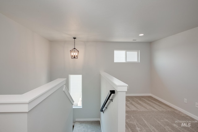 stairway with carpet flooring and baseboards