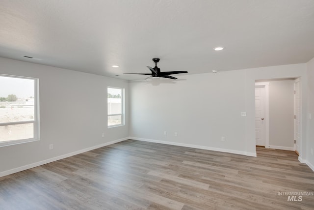 unfurnished room featuring light wood finished floors, recessed lighting, baseboards, and ceiling fan