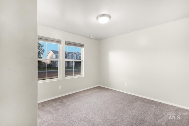 811 Pronghorn Dr, Twin Falls, ID 83301 - carpeted empty room featuring baseboards