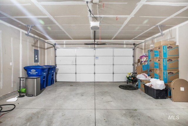 811 Pronghorn Dr, Twin Falls, ID 83301 - garage featuring a garage door opener and electric panel