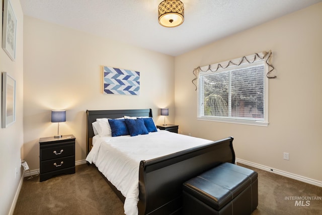 bedroom featuring baseboards and carpet floors