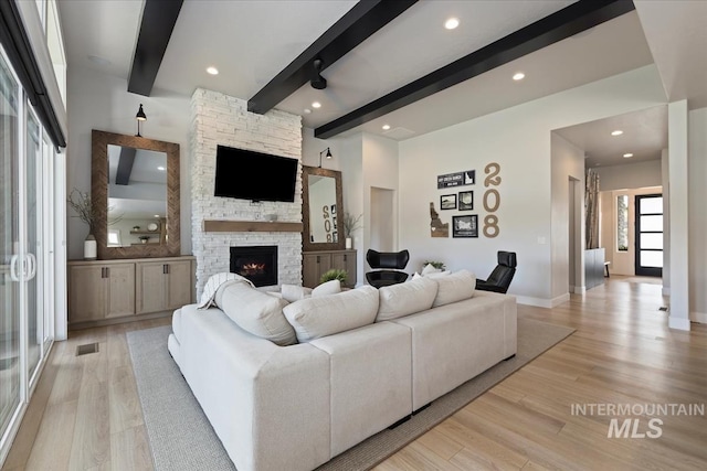 8749 W Suttle Lake Dr, Boise, ID 83714 - living room featuring recessed lighting, a fireplace, beam ceiling, and light wood-style floors