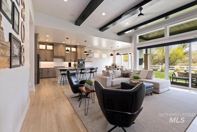 8749 W Suttle Lake Dr, Boise, ID 83714 - living area with baseboards, beam ceiling, light wood-type flooring, and recessed lighting