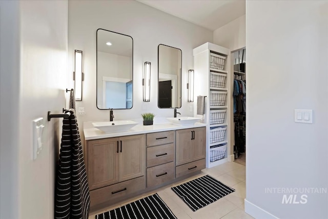 8749 W Suttle Lake Dr, Boise, ID 83714 - full bathroom with a walk in closet, double vanity, tile patterned flooring, and a sink