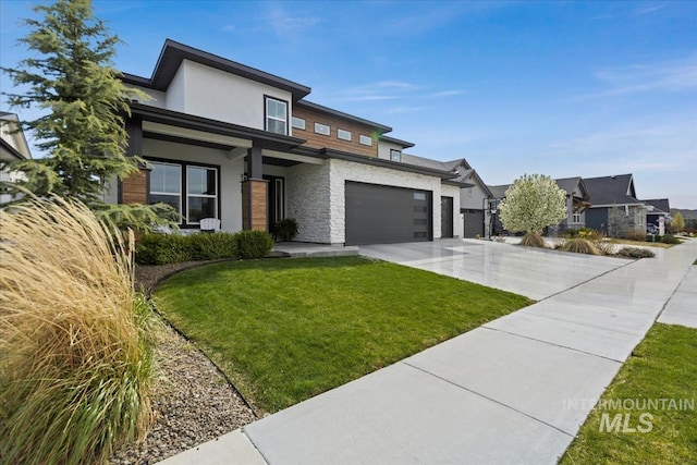 8749 W Suttle Lake Dr, Boise, ID 83714 - prairie-style home featuring a garage, driveway, a front yard, and stucco siding