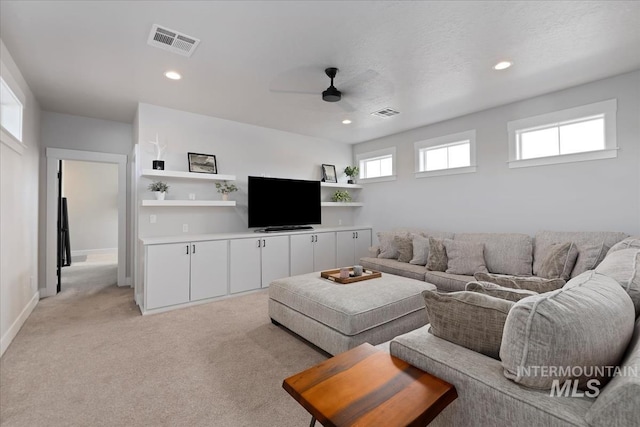 8749 W Suttle Lake Dr, Boise, ID 83714 - living room featuring recessed lighting, visible vents, baseboards, light colored carpet, and ceiling fan