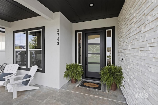 8749 W Suttle Lake Dr, Boise, ID 83714 - doorway to property with stucco siding