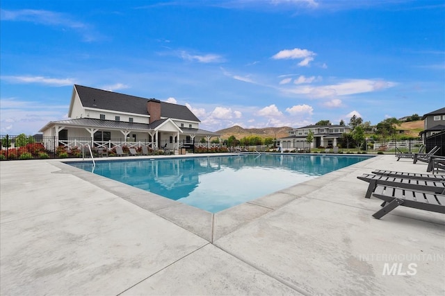 8749 W Suttle Lake Dr, Boise, ID 83714 - community pool with fence and a patio