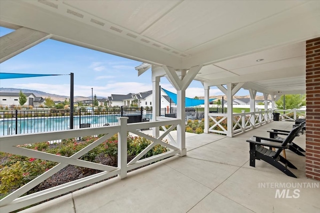 8749 W Suttle Lake Dr, Boise, ID 83714 - view of patio / terrace with a community pool and fence