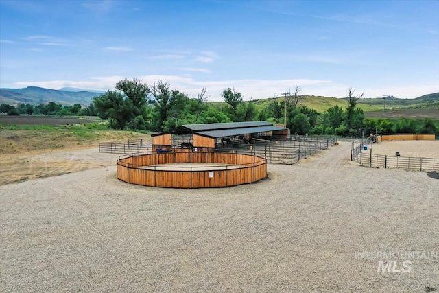 8749 W Suttle Lake Dr, Boise, ID 83714 - view of community featuring a rural view, an exterior structure, an outdoor structure, and a mountain view