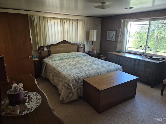 802 Foster Ave, Cottonwood, ID 83522 - bedroom with light carpet and wood walls