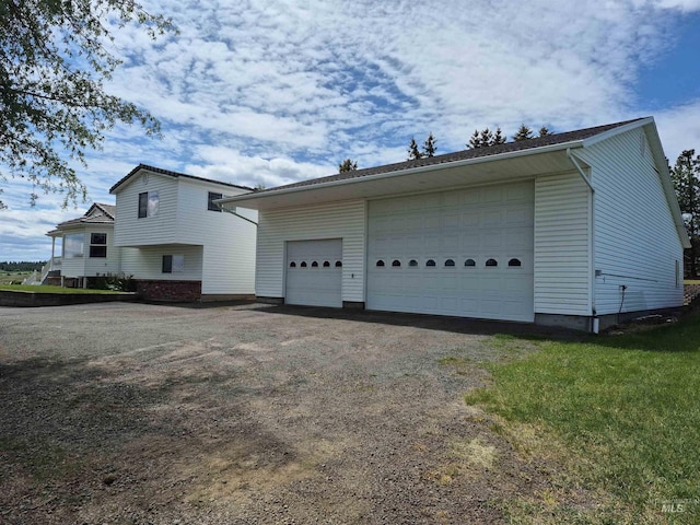 802 Foster Ave, Cottonwood, ID 83522 - view of side of home with a detached garage and an outdoor structure