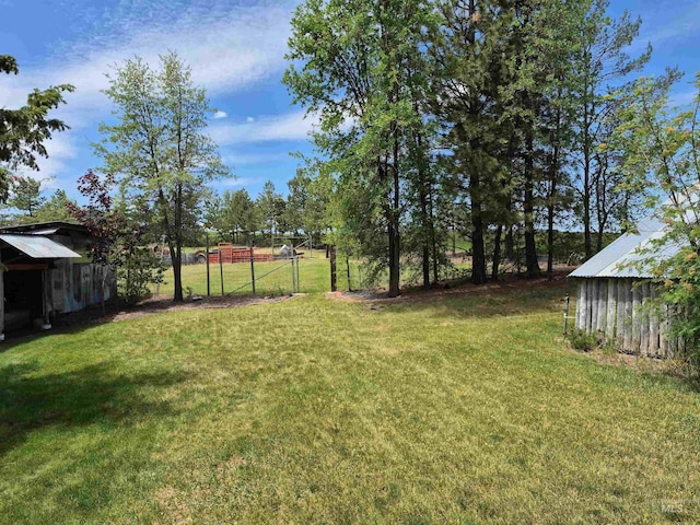 802 Foster Ave, Cottonwood, ID 83522 - view of grassy yard featuring an outbuilding