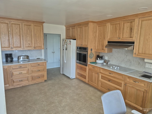 802 Foster Ave, Cottonwood, ID 83522 - kitchen featuring stainless steel oven, white refrigerator with ice dispenser, under cabinet range hood, electric cooktop, and light countertops