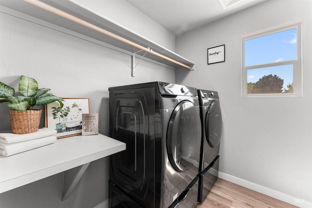 973 S Nautilus Ave, Boise, ID 83709 - laundry room with washing machine and dryer and light wood finished floors