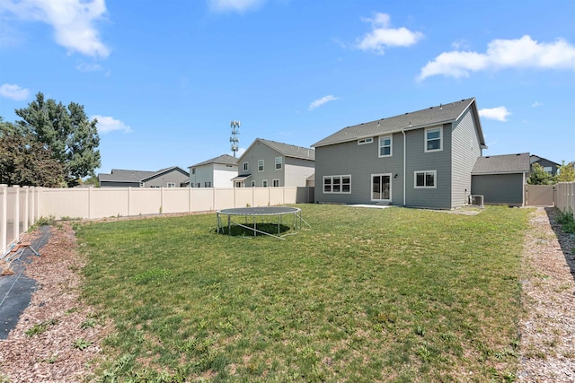 973 S Nautilus Ave, Boise, ID 83709 - rear view of house featuring a trampoline and a fenced backyard