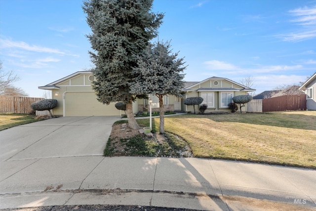 view of front of property with fence, a front lawn, and concrete driveway