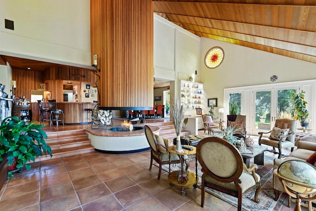 living room featuring tile patterned floors, french doors, high vaulted ceiling, and wood ceiling