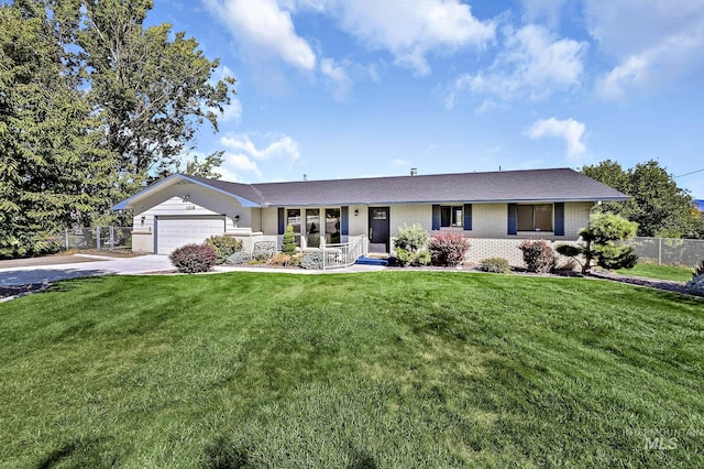 ranch-style house with a garage, brick siding, a front yard, and fence