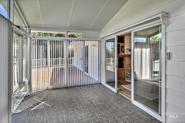 unfurnished sunroom with vaulted ceiling