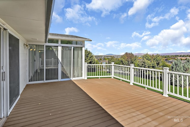 wooden terrace featuring a mountain view