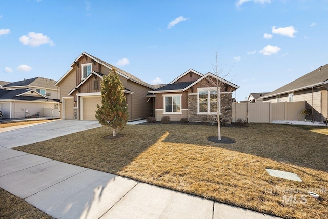 view of front of house featuring a garage and a front lawn