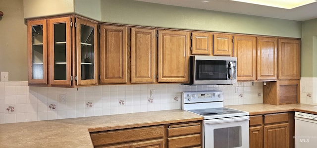 5720 N Oasis, Garden City, ID 83714 - kitchen with white appliances, brown cabinetry, and light countertops