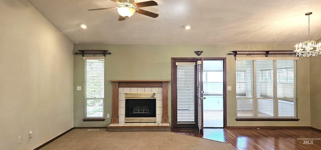 5720 N Oasis, Garden City, ID 83714 - unfurnished living room with a fireplace, plenty of natural light, and a ceiling fan