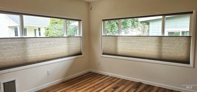 5720 N Oasis, Garden City, ID 83714 - unfurnished room featuring baseboards and wood finished floors